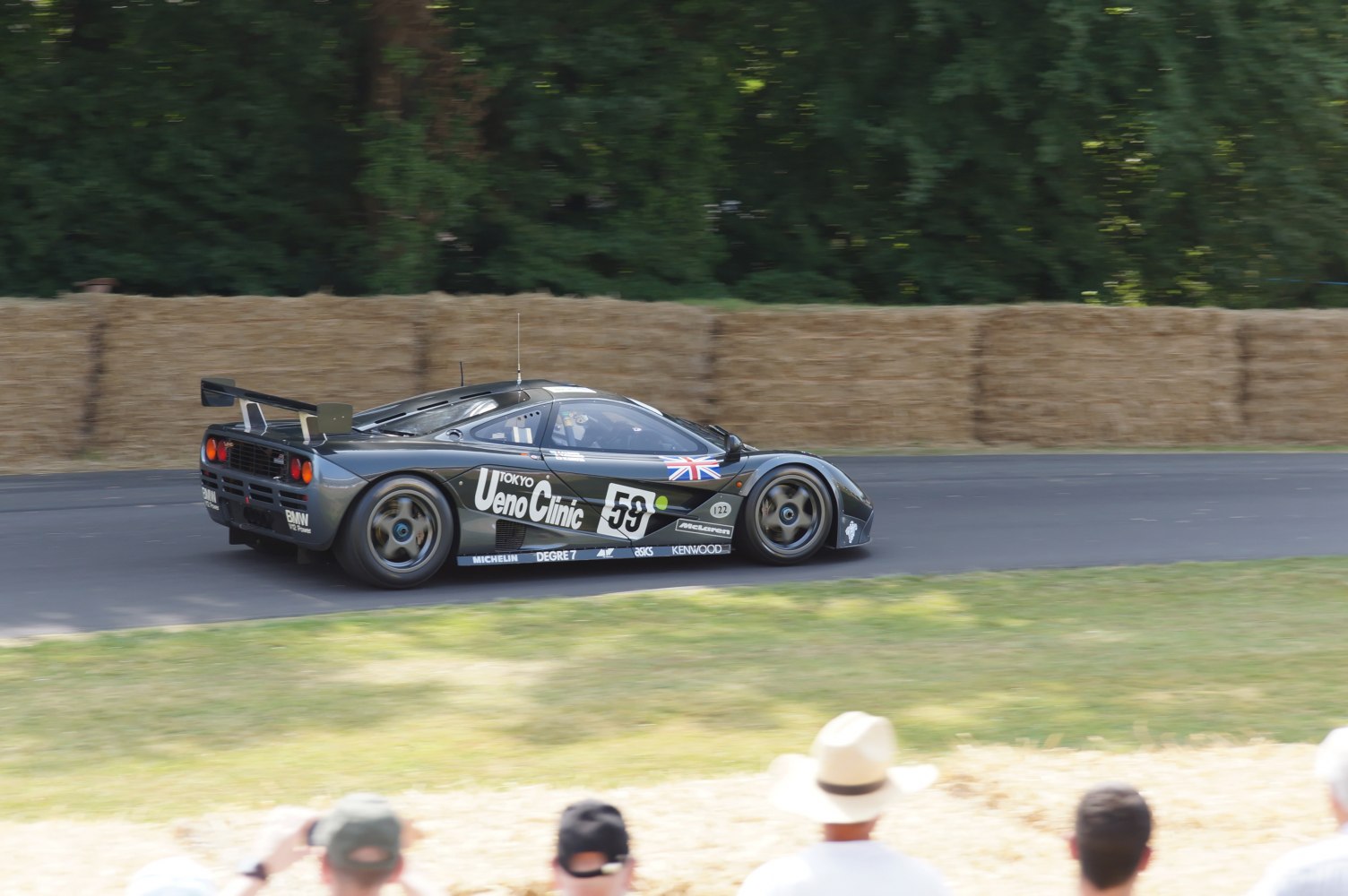 Side profile of a McLaren F1 GTR race car with rear wing and decals