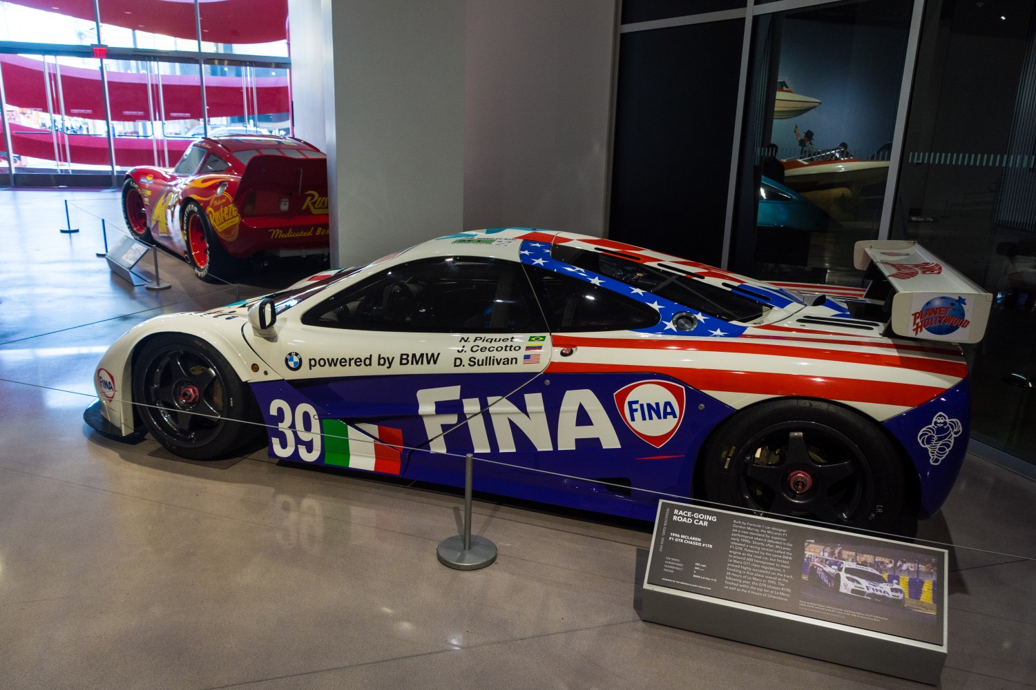 Race car with FINA livery and large rear wing