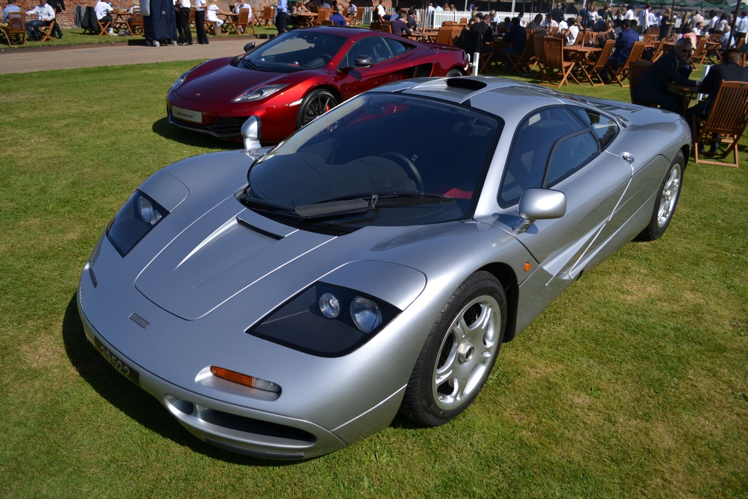 silver classic supercar with pop-up headlights and aerodynamic body