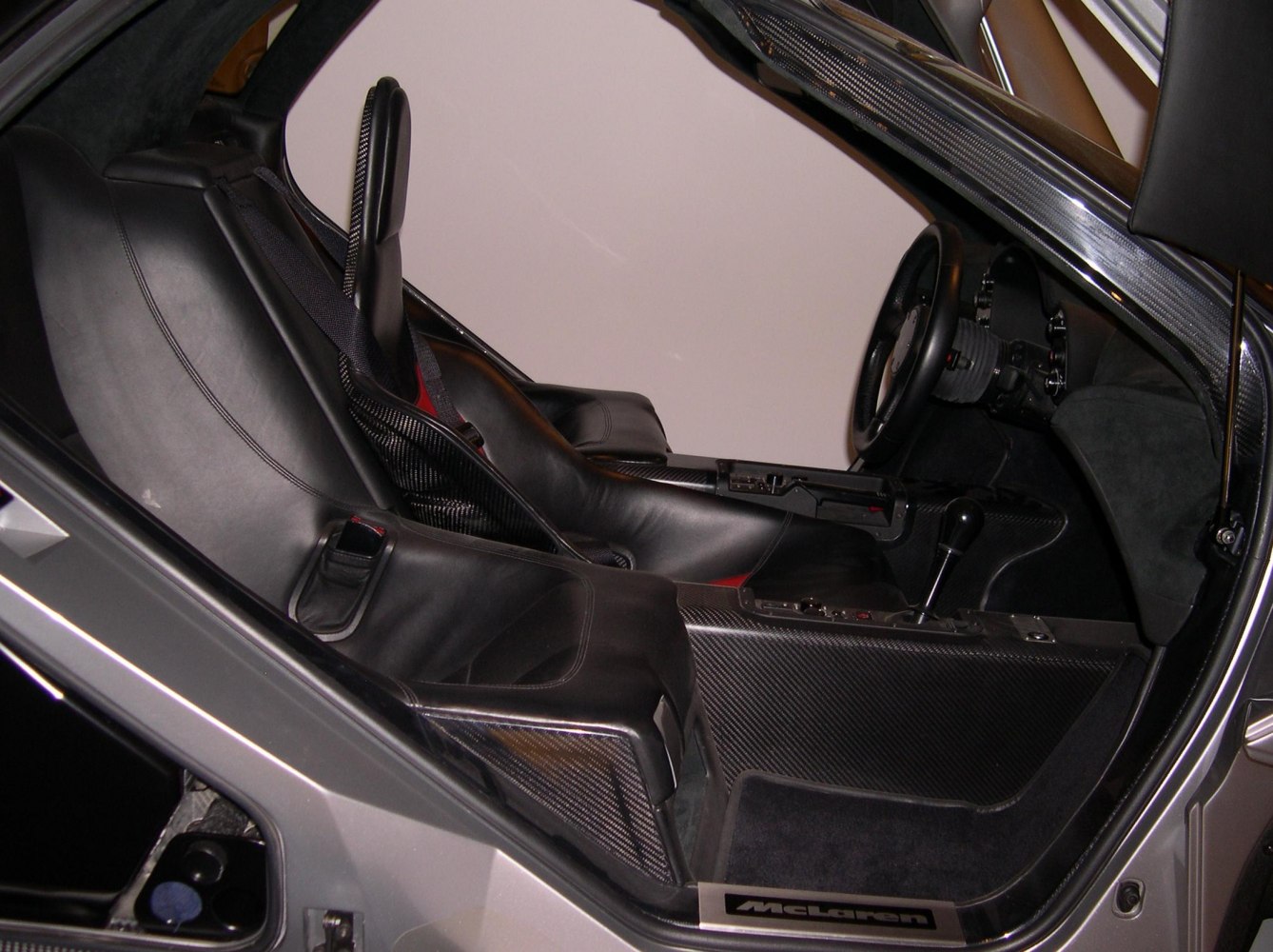 Leather seats and carbon fiber panels inside a high-performance sports car