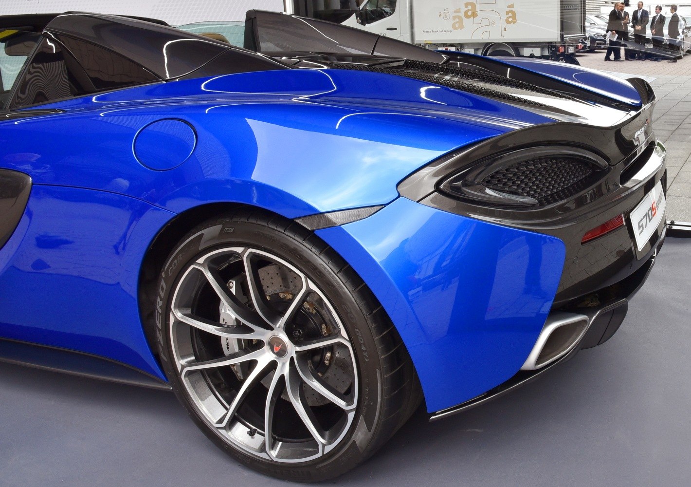 Close-up of rear wheel and taillight of a sports car