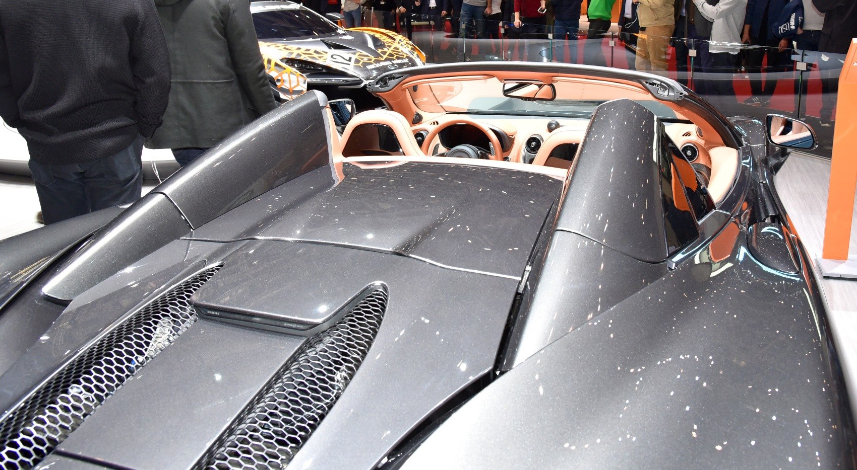Rear deck and convertible interior with open roof.