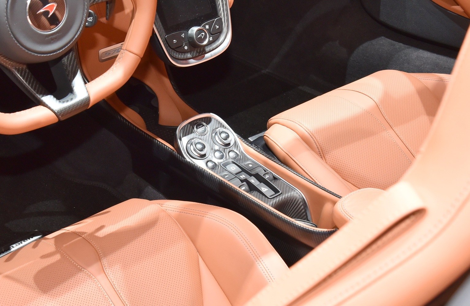 Carbon fiber center console and tan leather seats interior