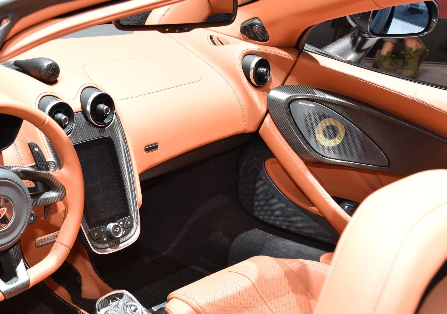 Luxury interior with carbon fiber, leather seats, and premium audio system