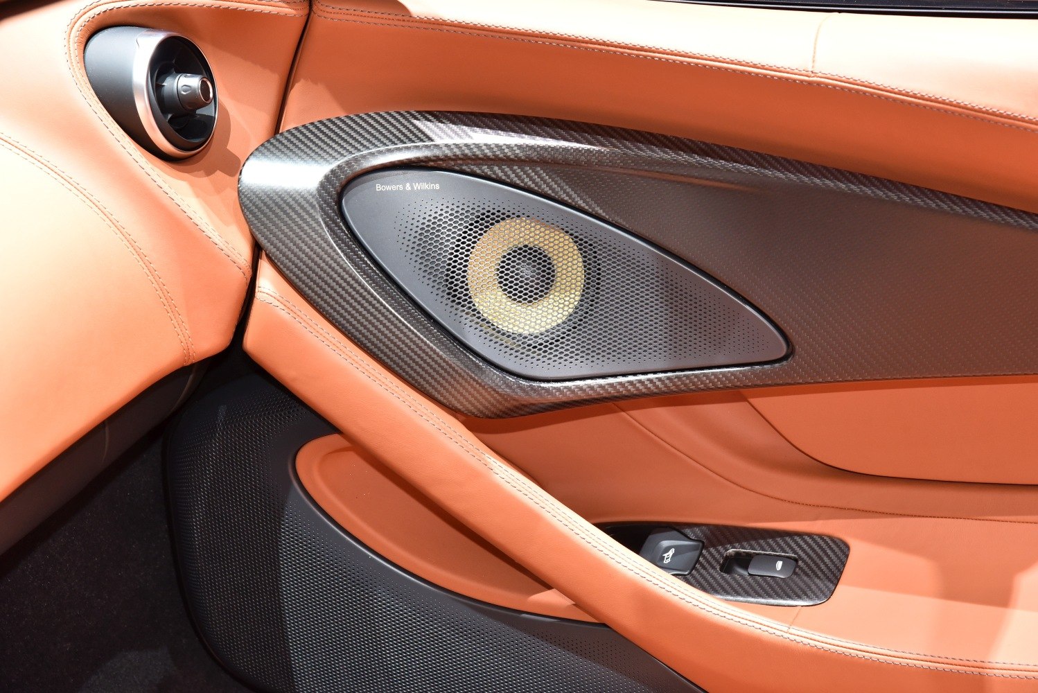 Premium car door panel with Bowers & Wilkins speaker and carbon fiber trim