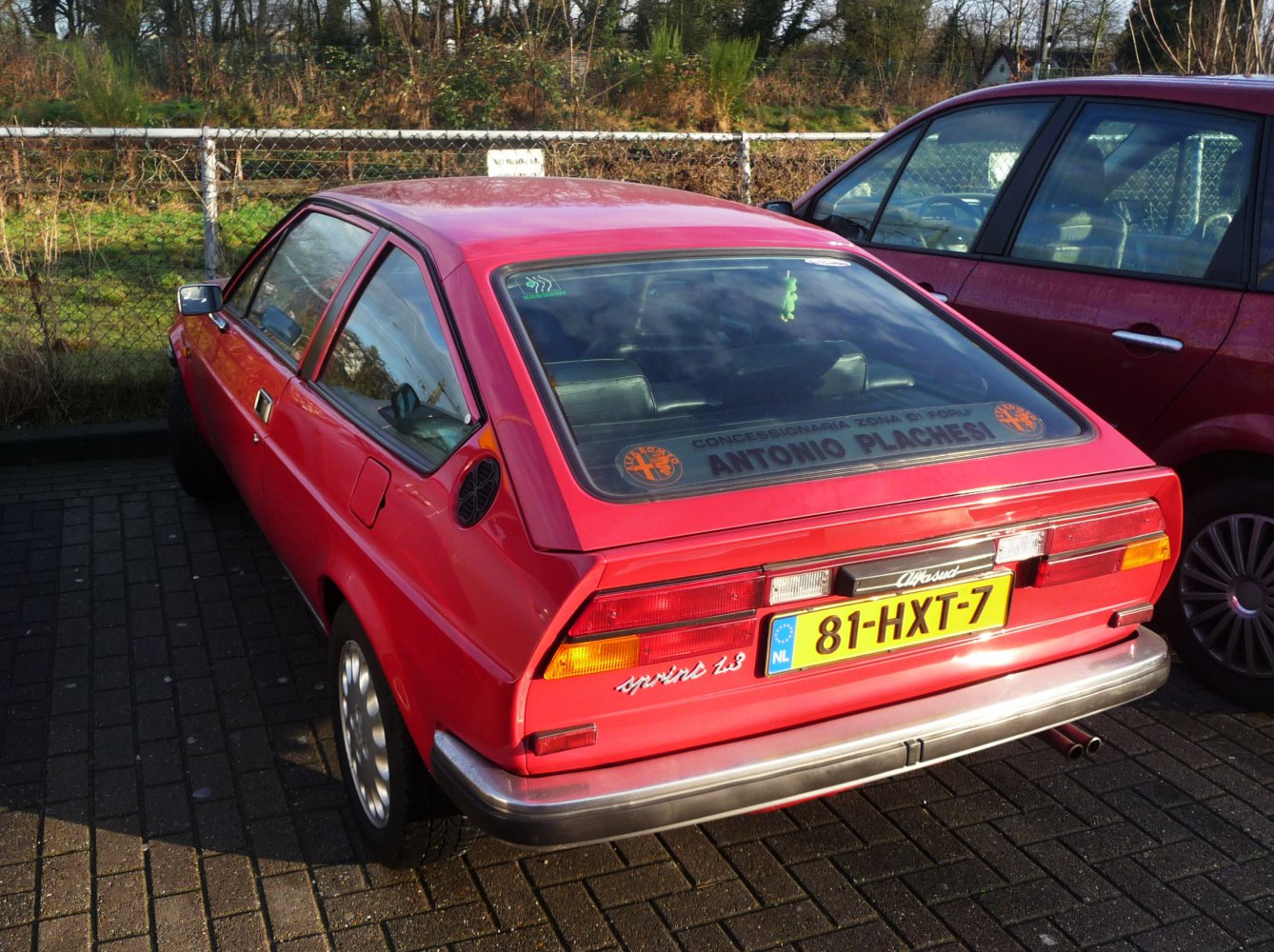 Rear hatchback view with angular window and taillights