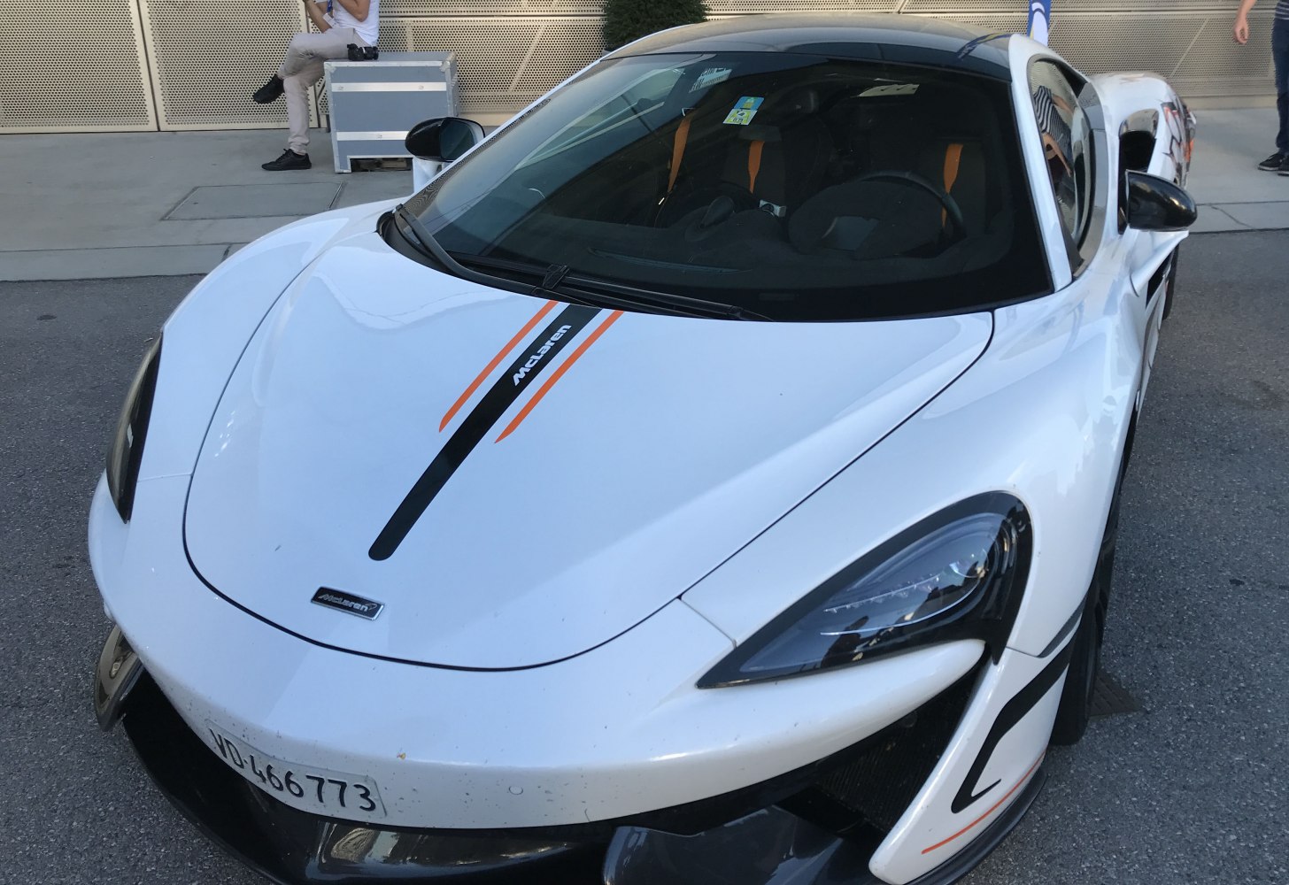 Front view, aerodynamic design, racing stripes, sleek headlights