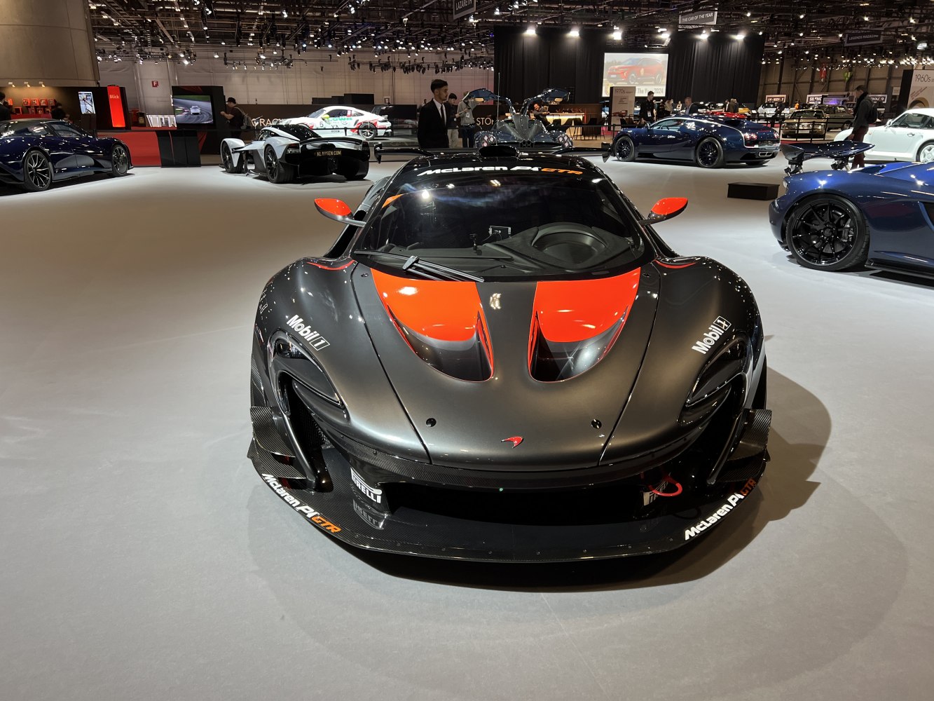 Front view of a high-performance supercar with aerodynamic hood vents and splitter