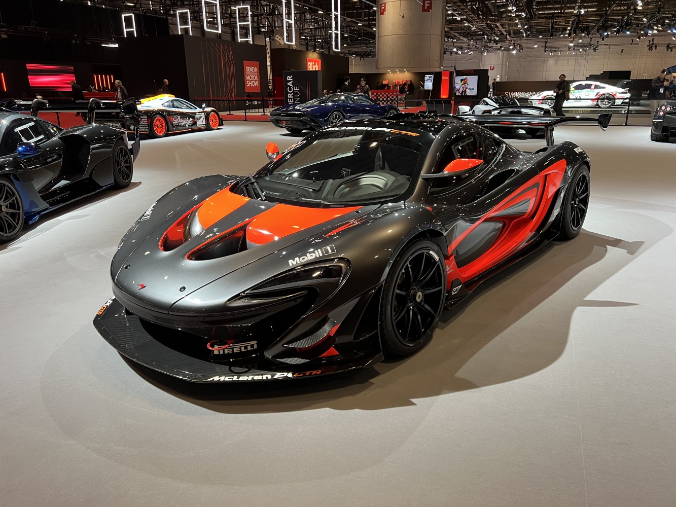 Aerodynamic race car with large rear wing and sleek body design
