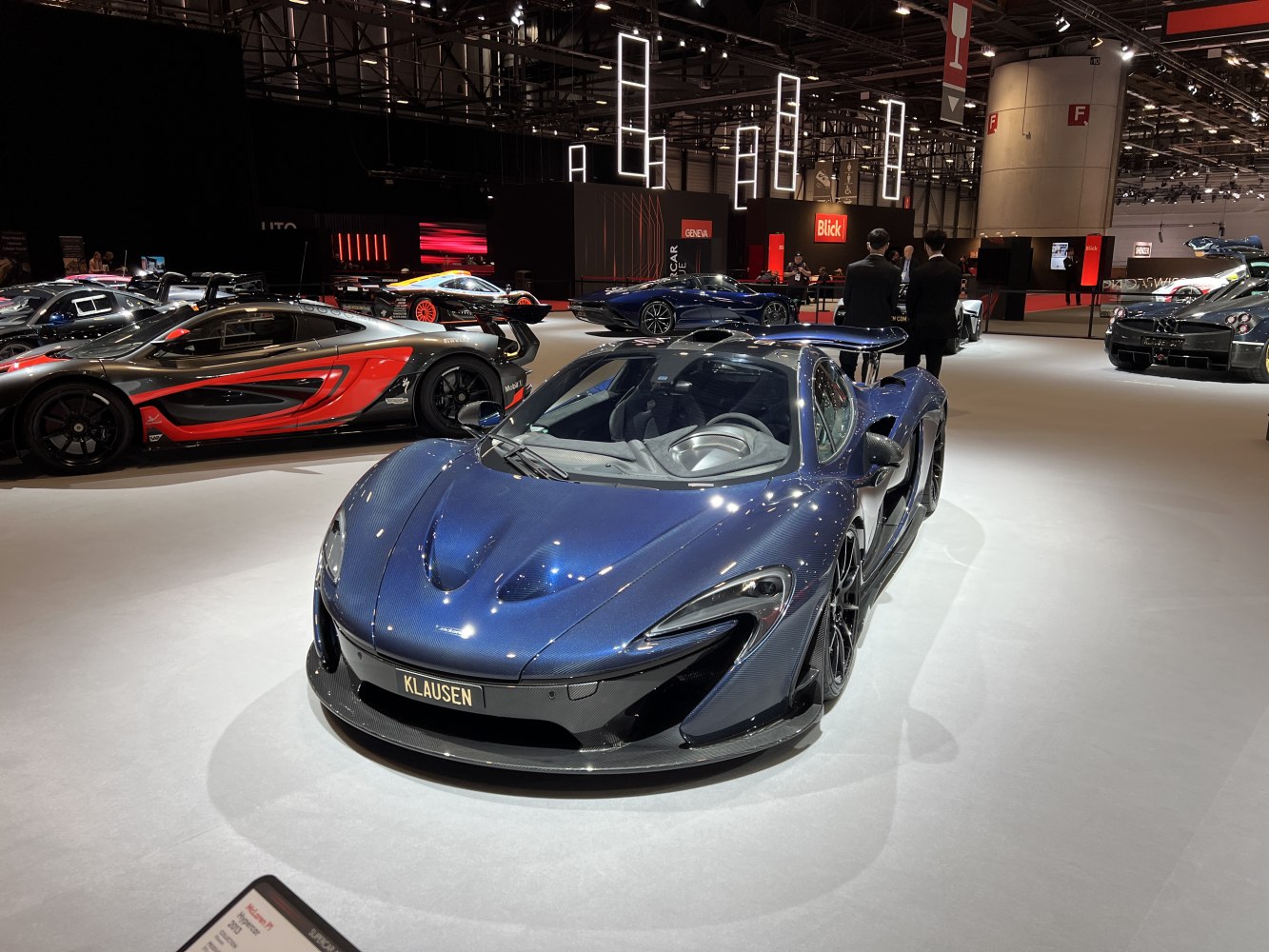 Carbon fiber body with large rear wing on a high-performance hypercar.
