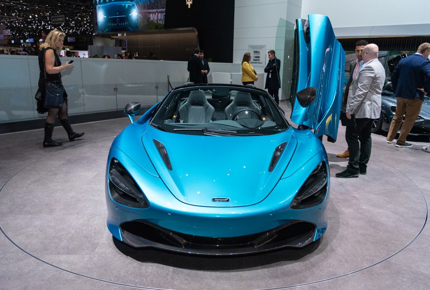 Blue convertible with butterfly doors and aerodynamic vents