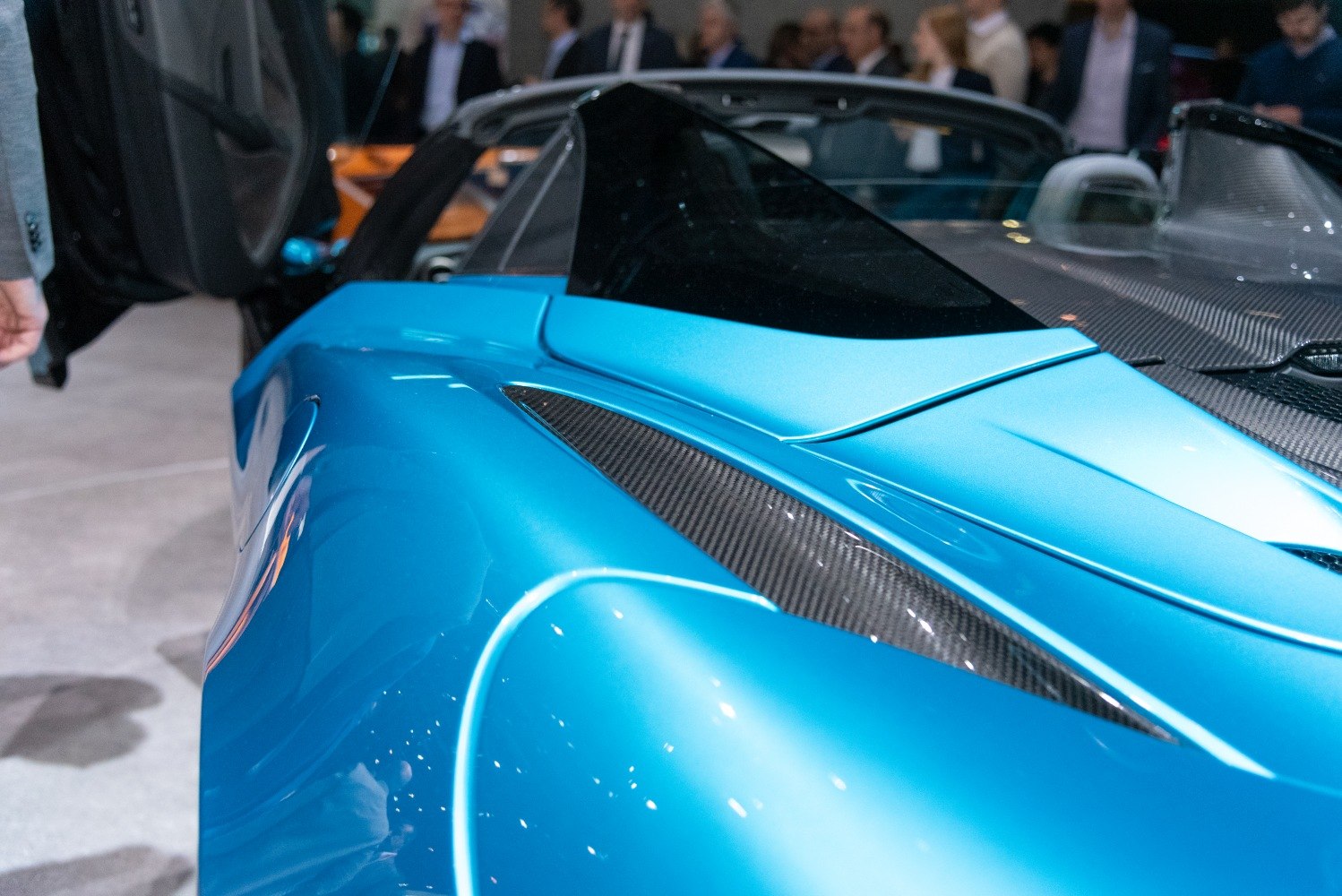 Streamlined rear with carbon fiber vents and aerodynamic curves.