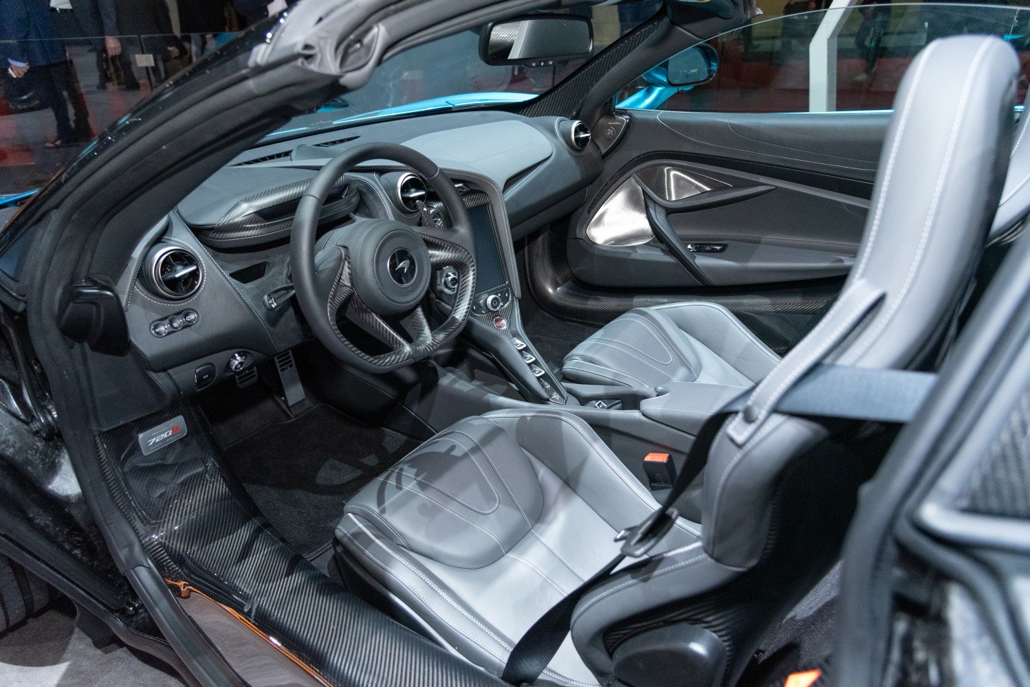 Carbon fiber trim and leather sports seats with advanced cockpit layout