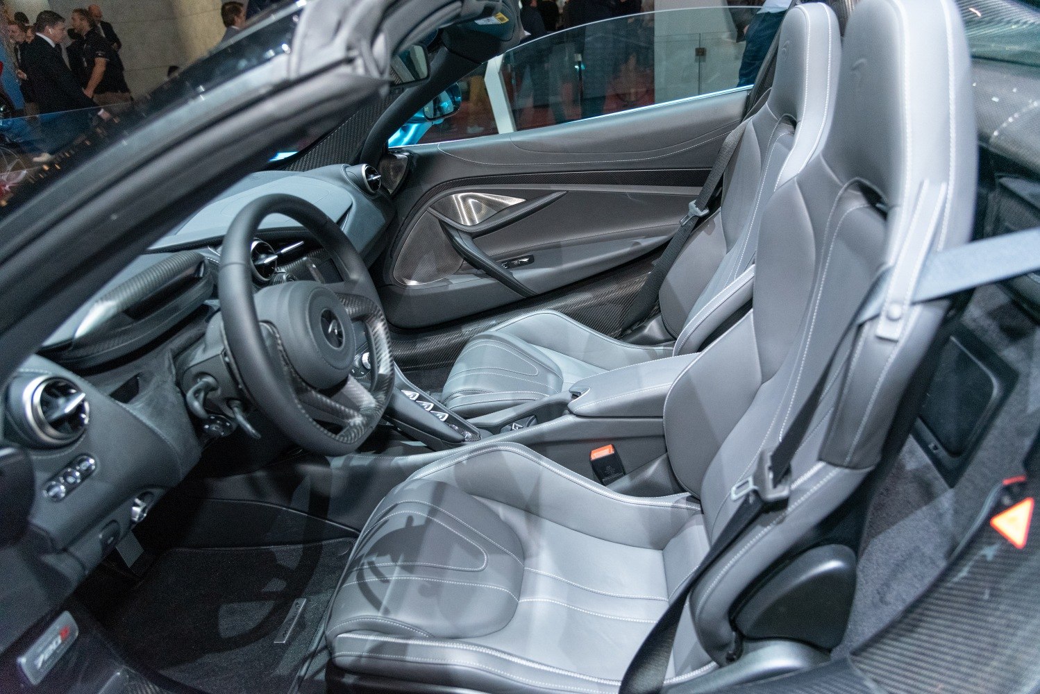 Luxury sports car interior with carbon fiber and leather seats