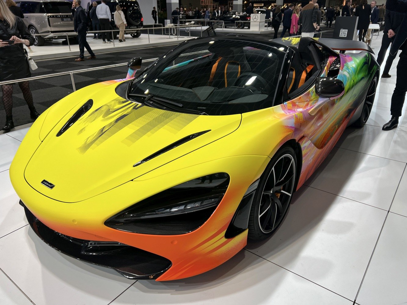 Colorful art-wrapped convertible with aerodynamic front and sporty wheels