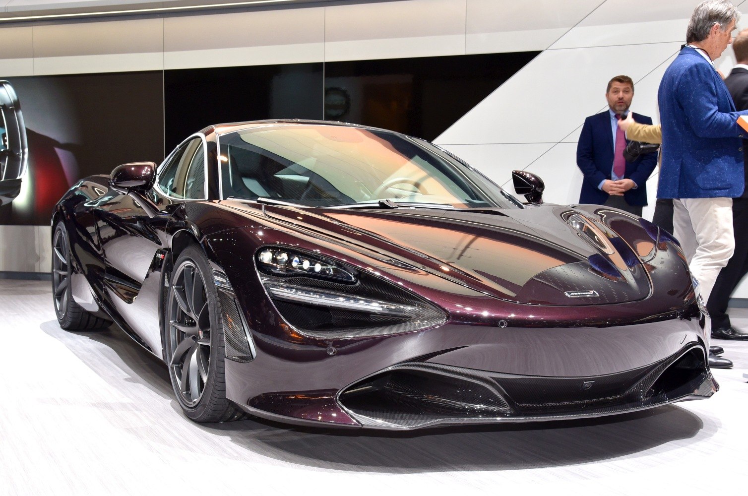 Front view of a supercar focusing on aerodynamic design and LED headlights