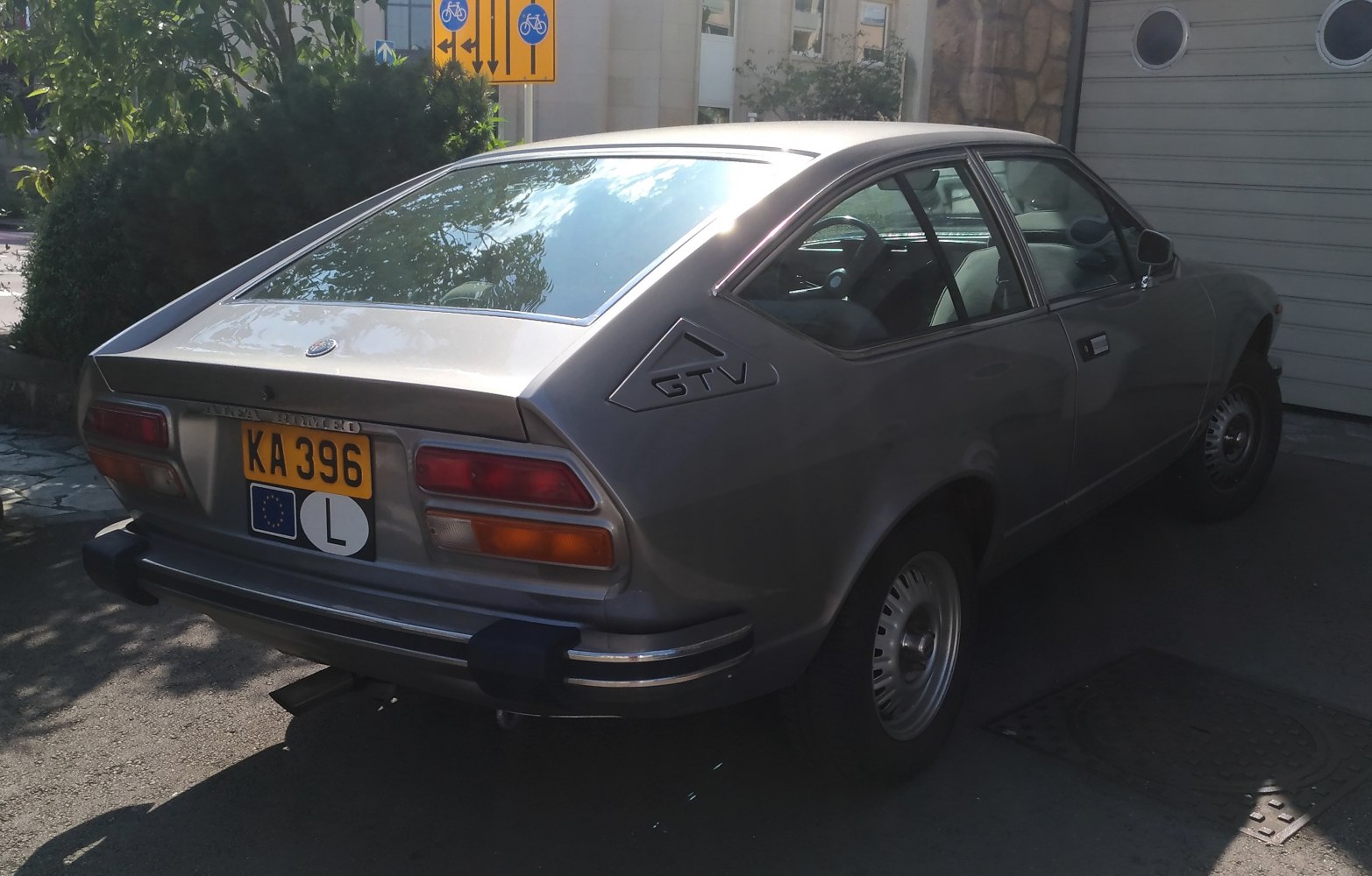 Rear view of hatchback with distinct taillights and side GTV badge