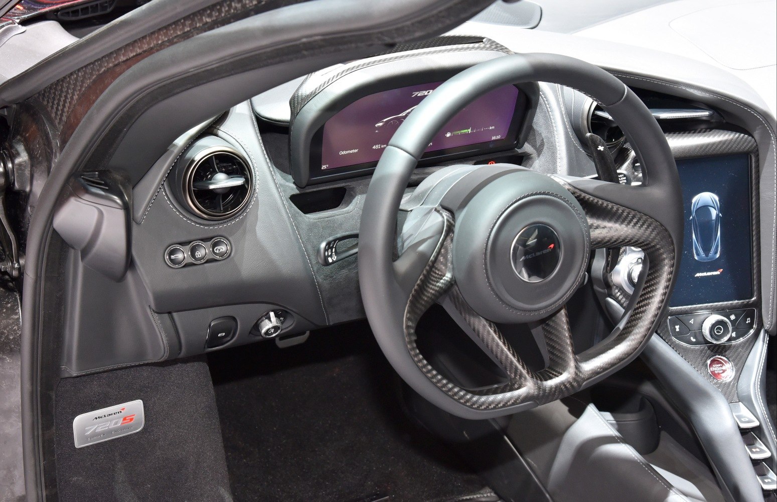 Carbon fiber steering wheel with digital instrument cluster and infotainment display