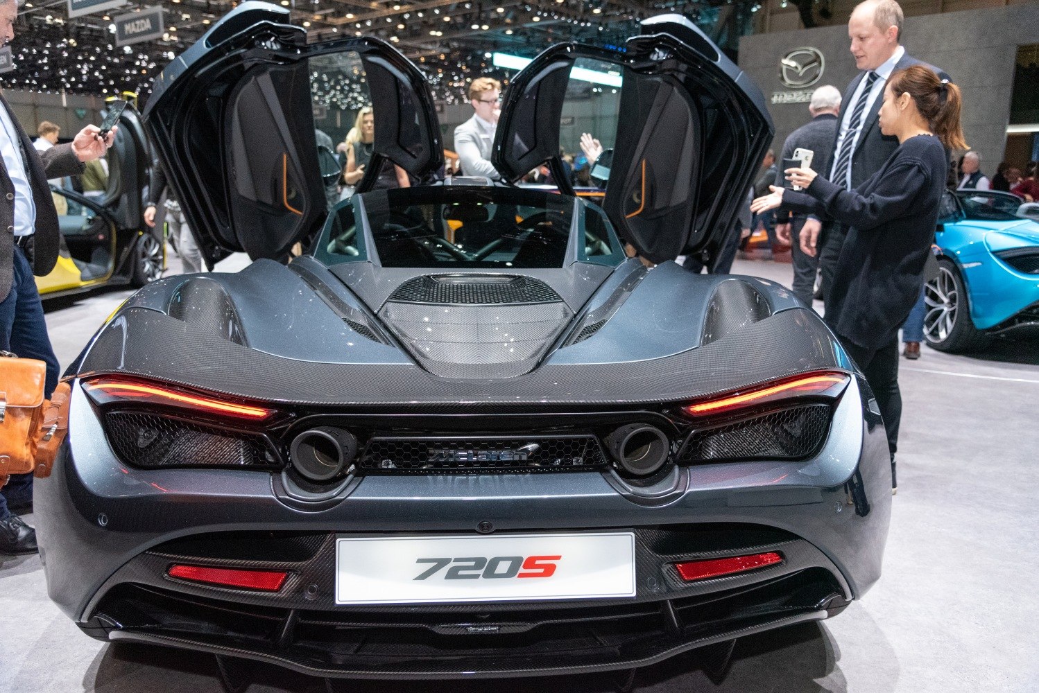 Rear view of sports supercar with open dihedral doors