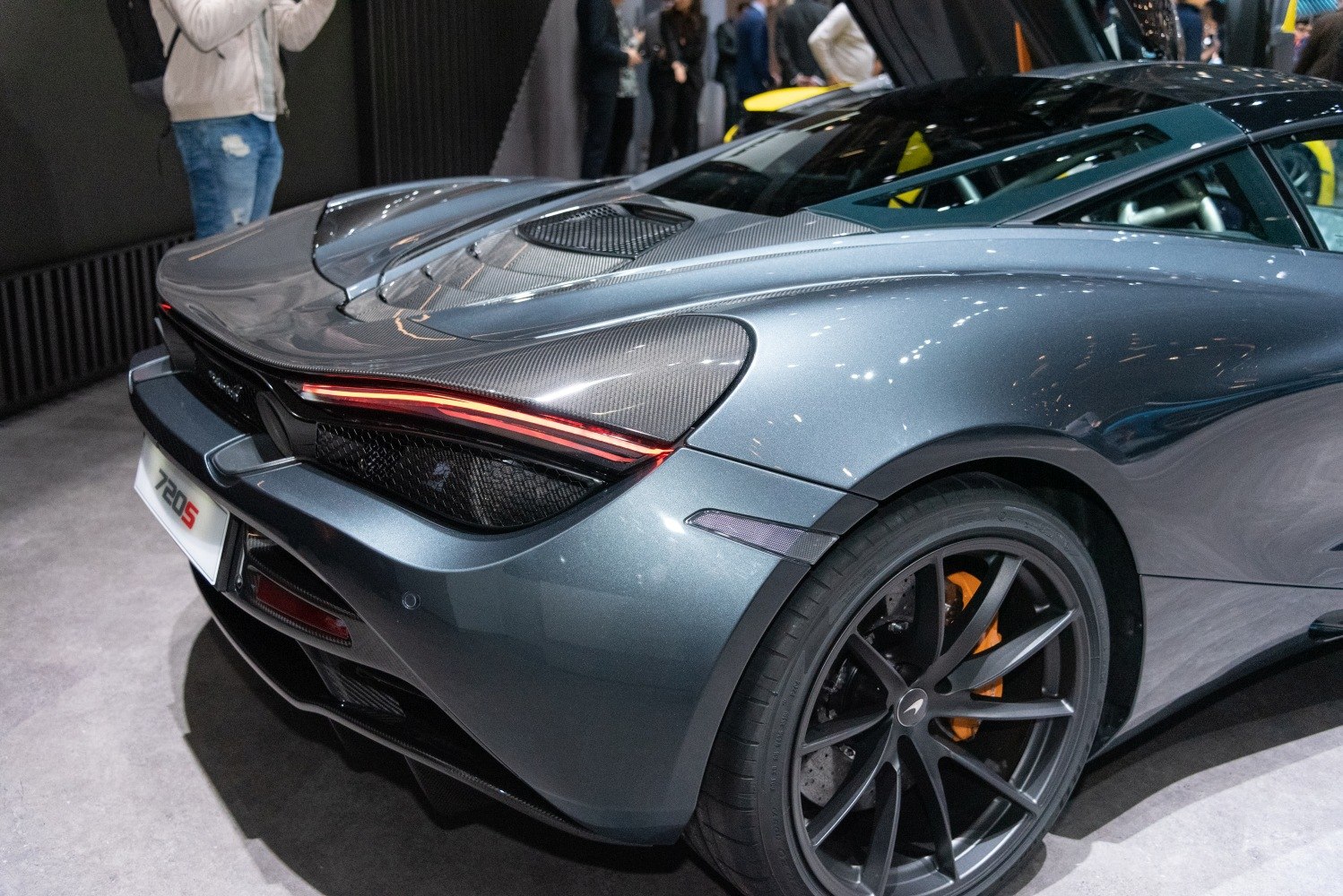 Rear tail light and wheel design with carbon fiber details