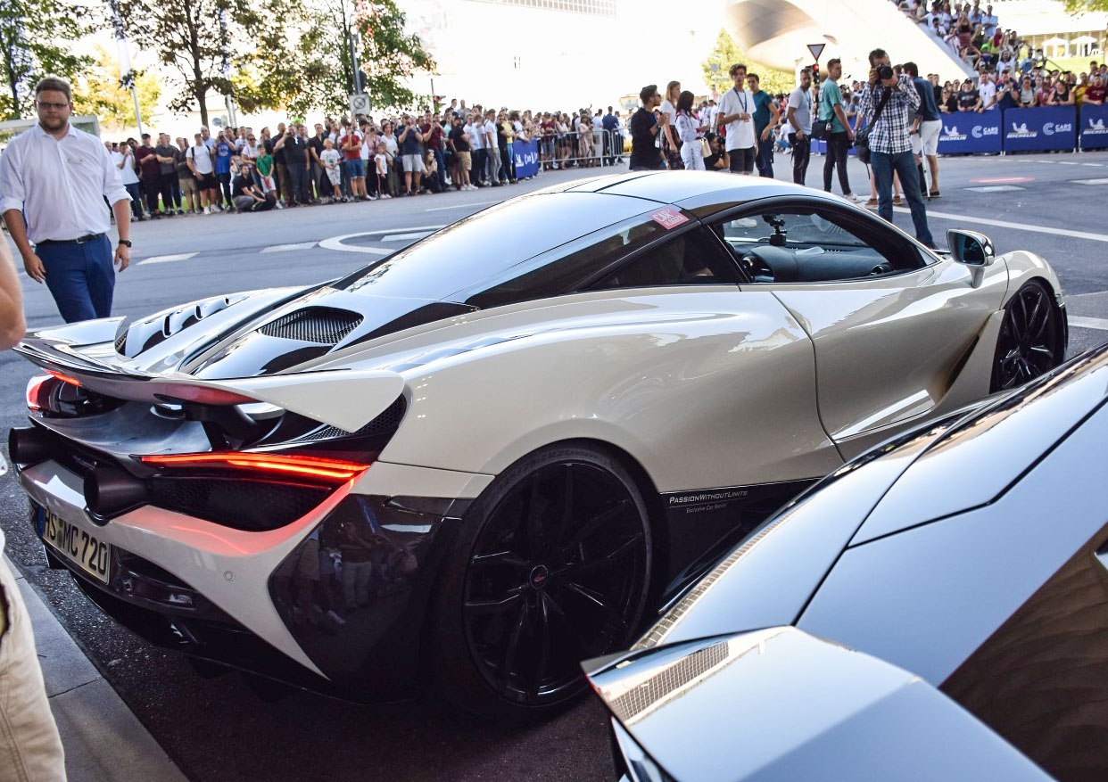 Rear view featuring active rear wing and aerodynamic contours
