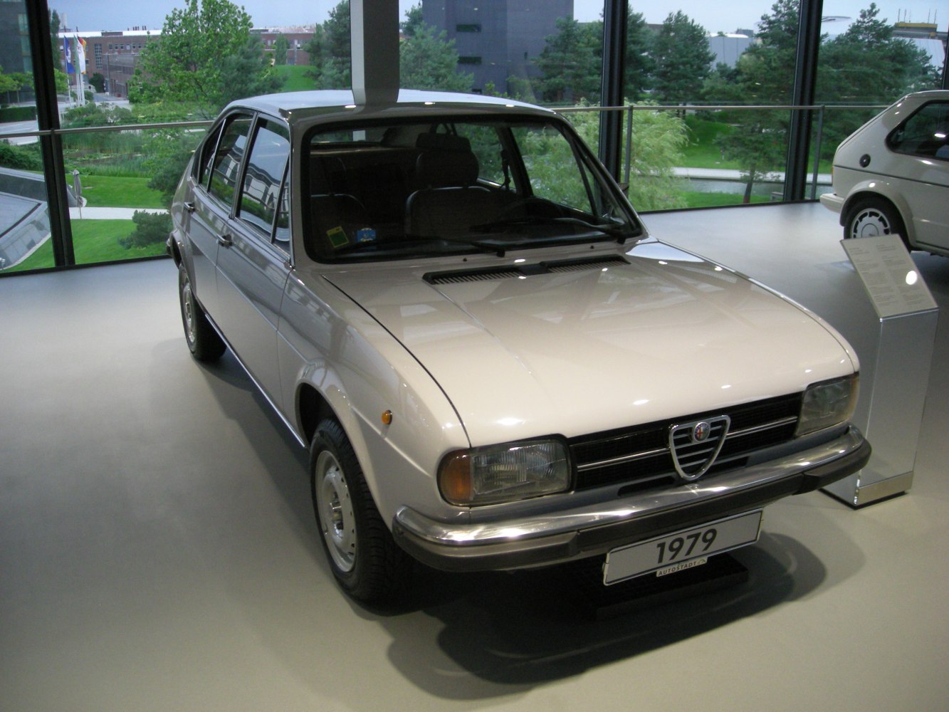 Front view of vintage hatchback with Alfa Romeo grille and rectangular headlights
