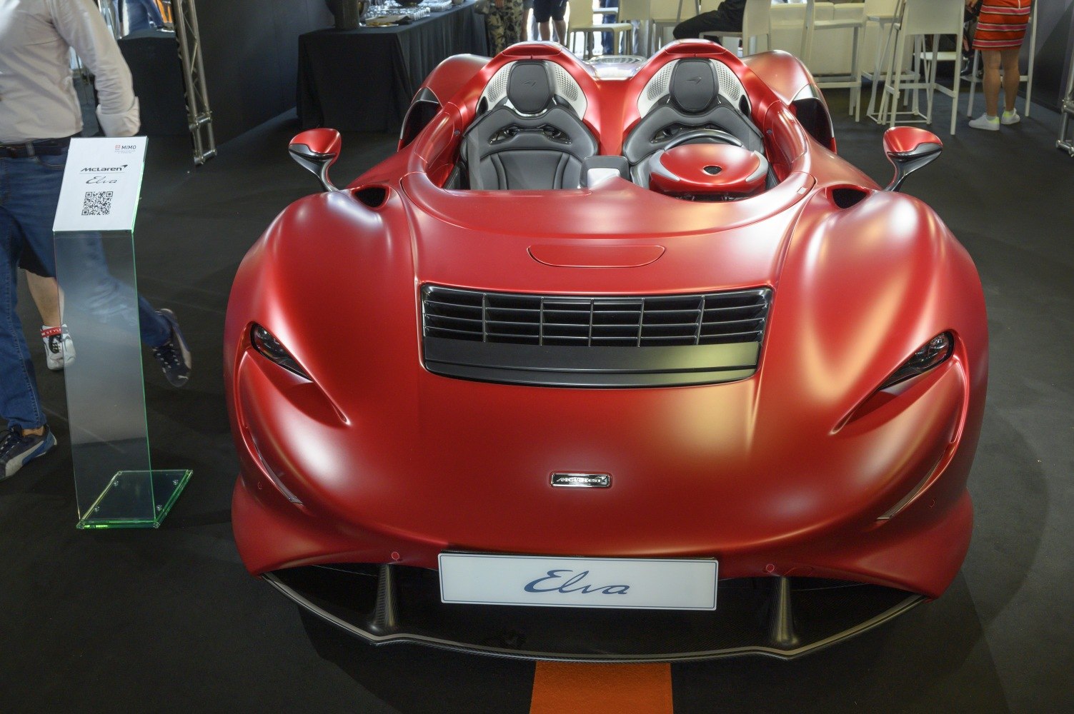 Aerodynamic open-top front view with two-seater cockpit.