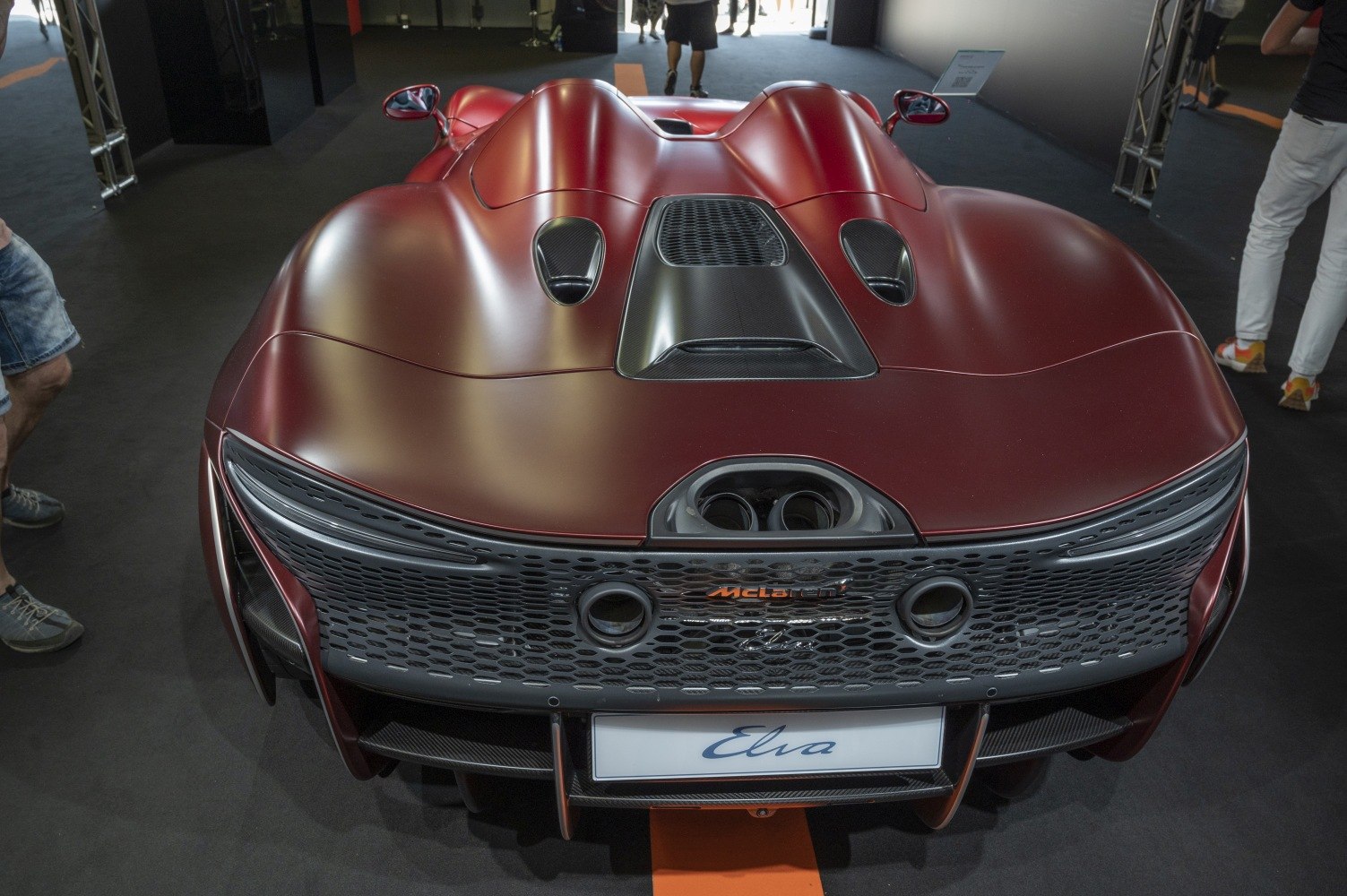 Rear view with distinctive exhaust outlets and carbon fiber aerodynamic design