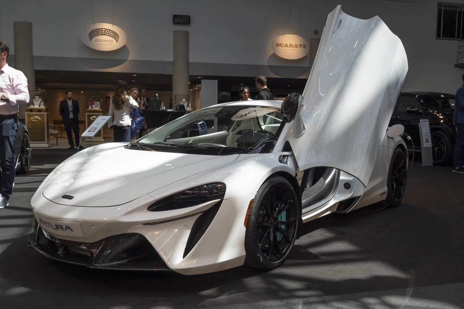 White McLaren Artura with dihedral doors open
