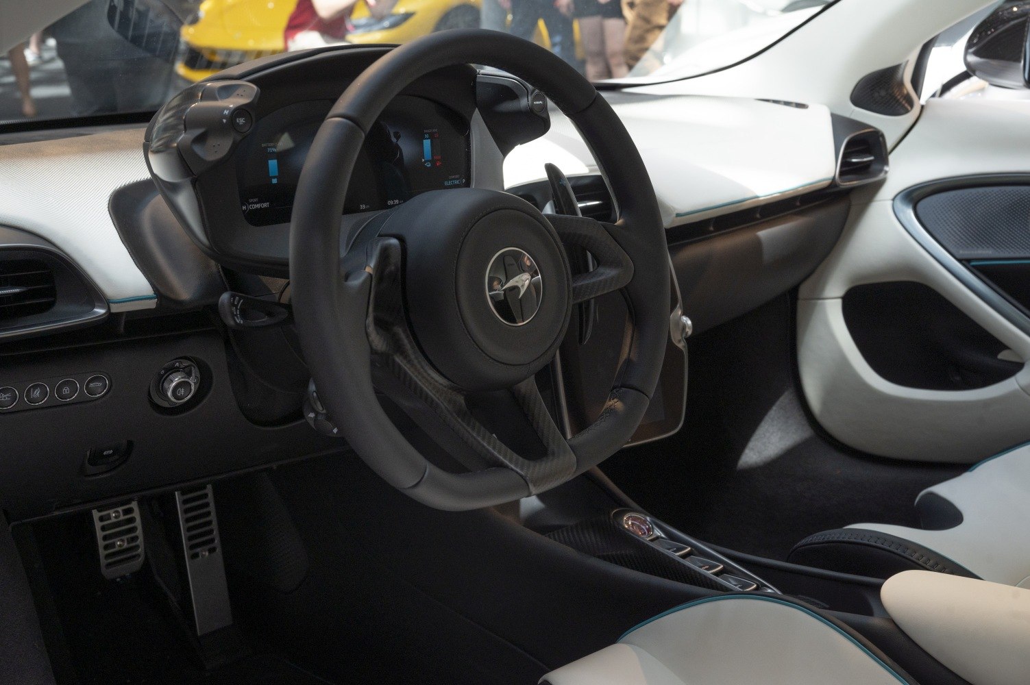 Luxury sports car interior with digital dashboard and unique steering wheel design