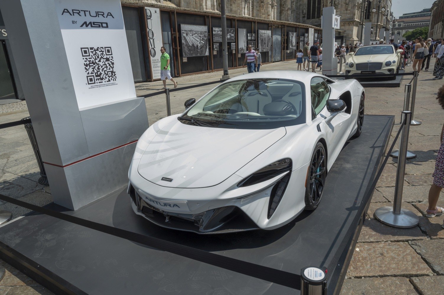 White McLaren Artura sports coupe with aerodynamic styling and carbon fiber details