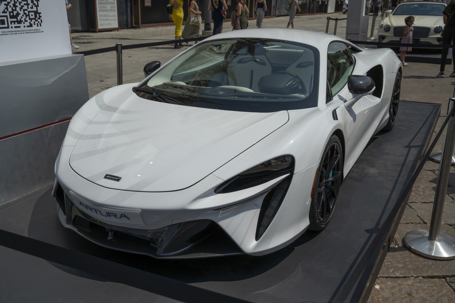 White sports car with aerodynamic shape and black alloy wheels