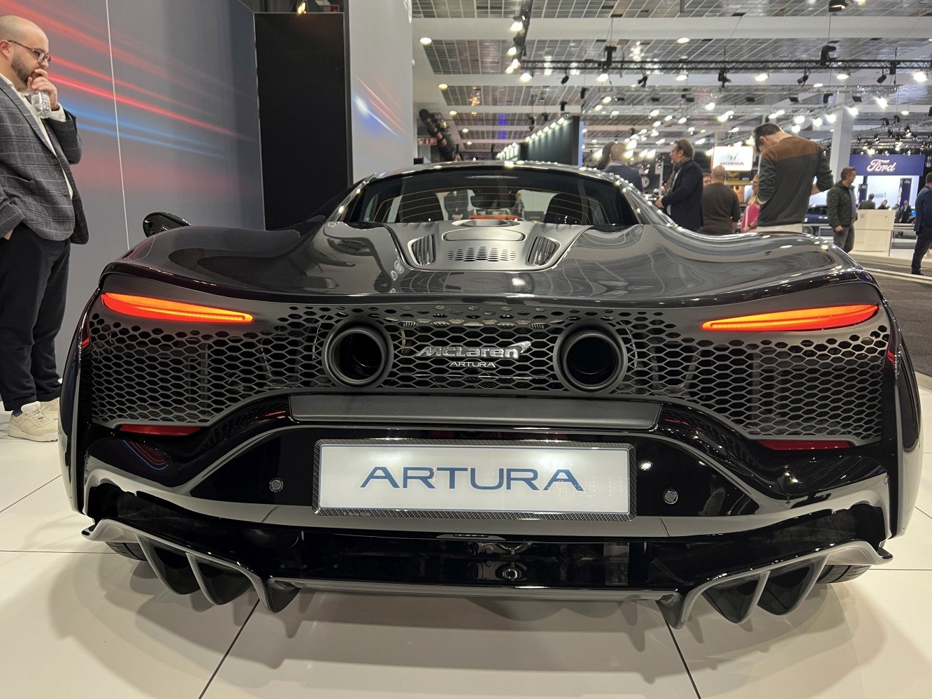 Rear view with signature taillights, dual exhausts, and aerodynamic diffuser.