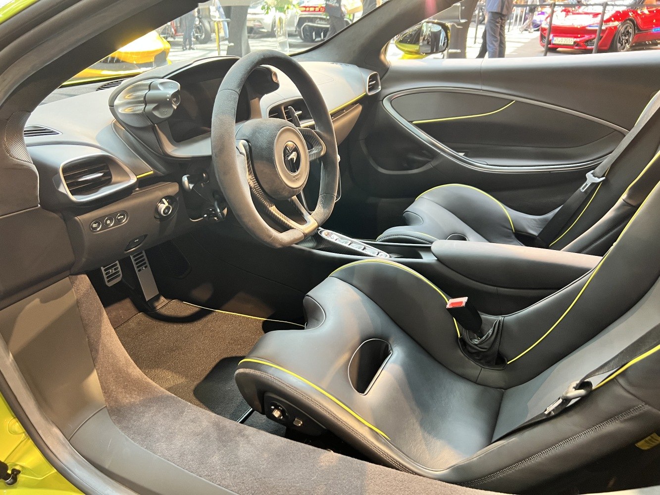 Sporty bucket seats and modern steering wheel in a high-performance car interior