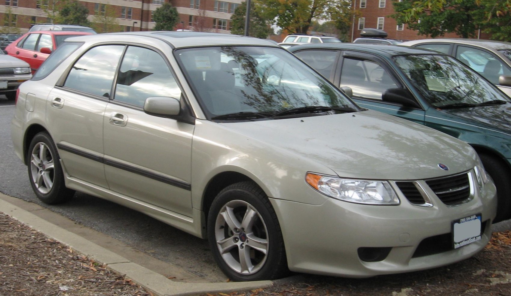 Front-side view of a compact sedan with alloy wheels parked outdoors
