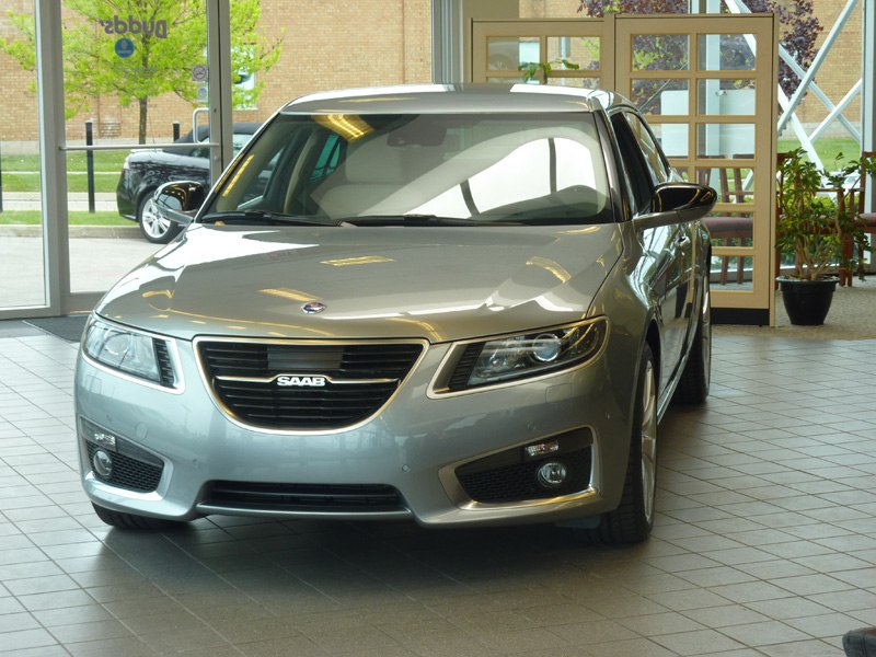 Front grille and headlights of a sedan in showroom