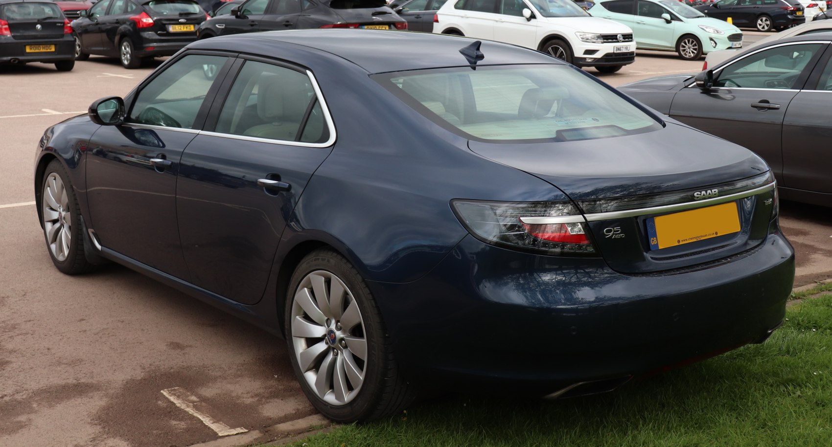 Rear side view of a sedan with sleek curves and distinct taillights