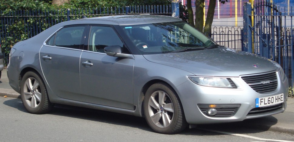 Silver mid-size sedan with five-spoke alloy wheels parked on street