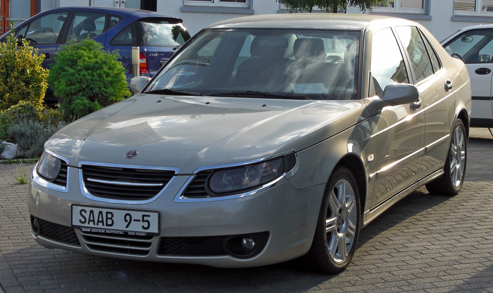 Front view with distinctive headlights, grille, alloy wheels