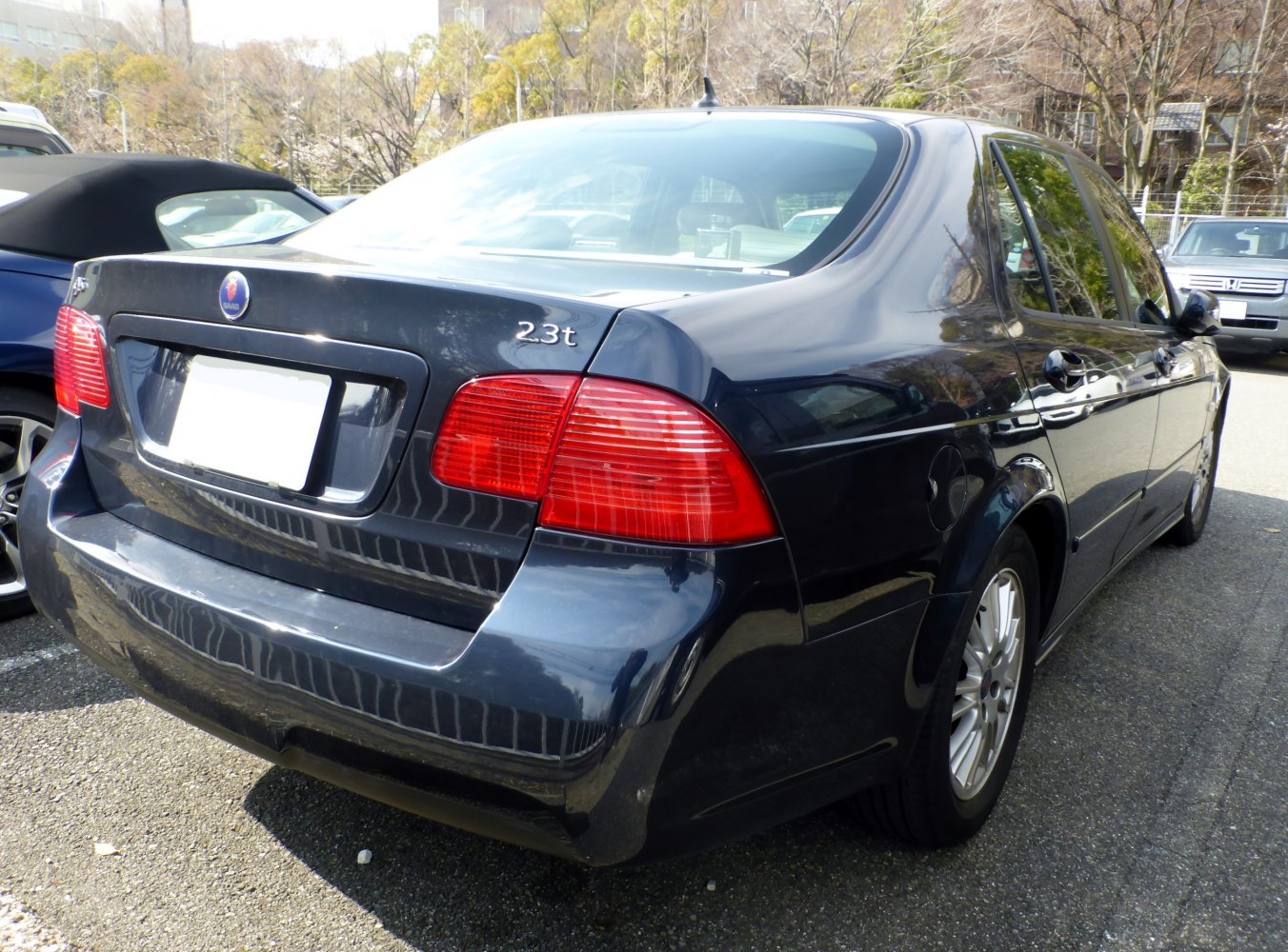 Rear view showing tail lights and trunk with 23t badge.