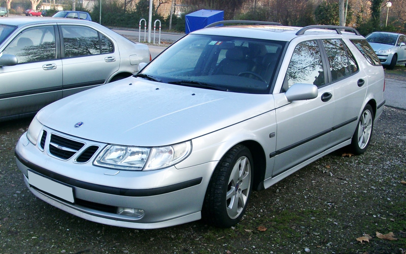 Silver station wagon front exterior with headlights and alloy wheels