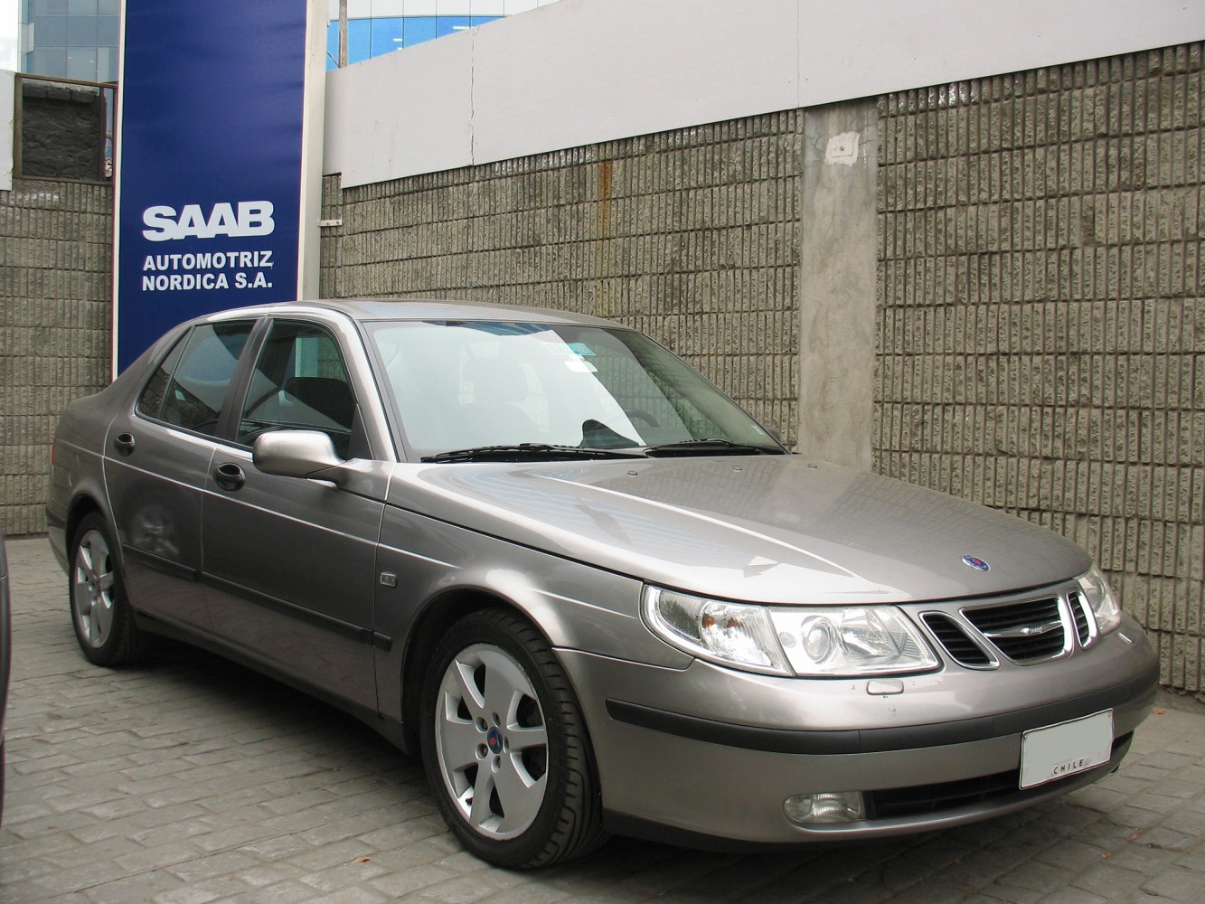 Silver sedan front side view with distinct headlights and grille
