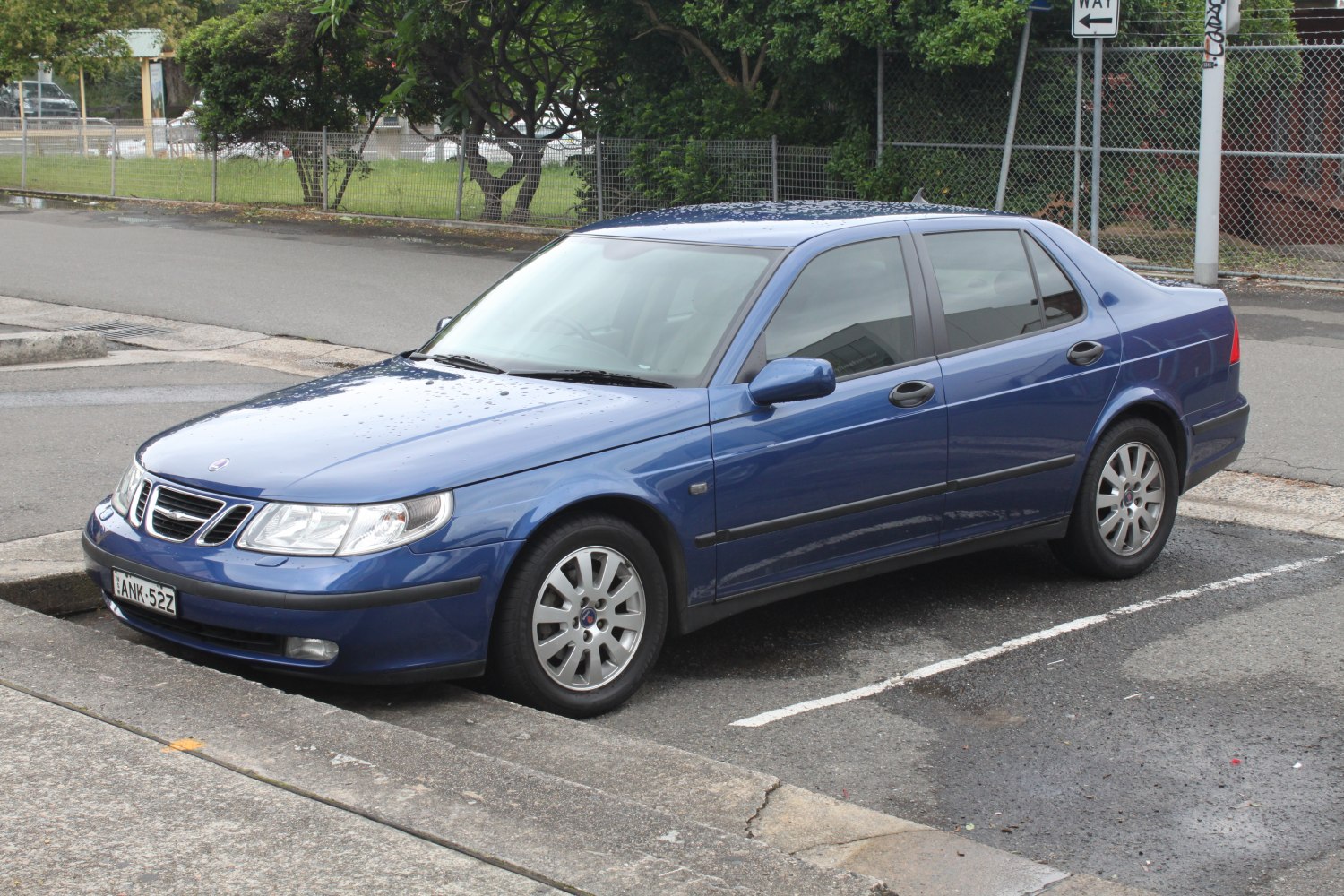 Blue sedan with front-side view and alloy wheels