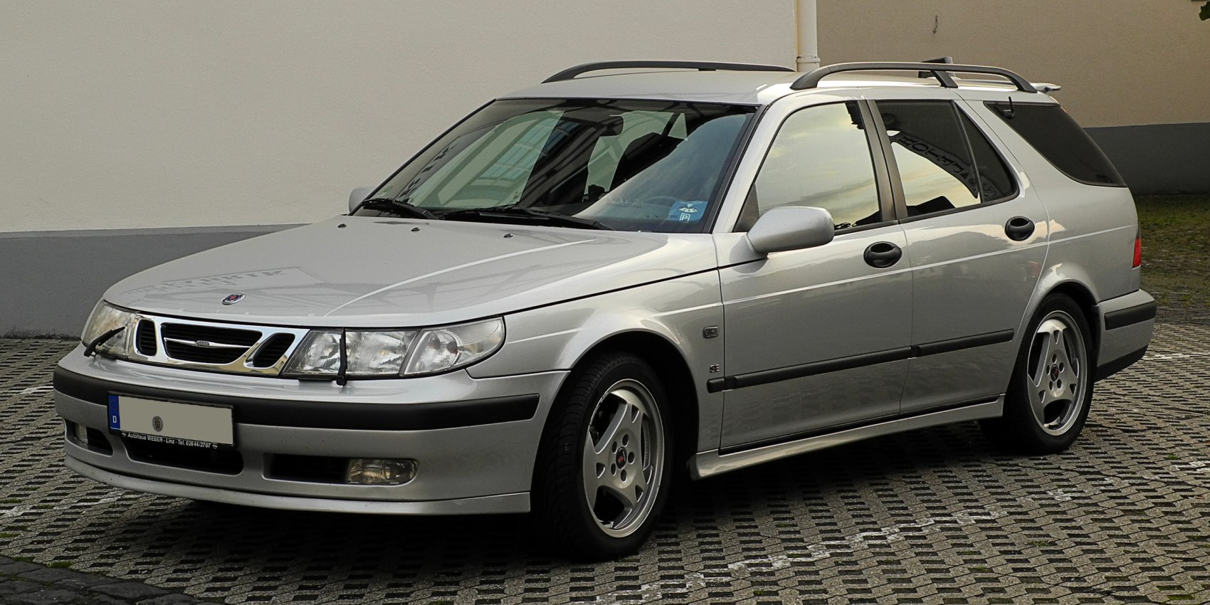 Silver station wagon with roof rails and alloy wheels