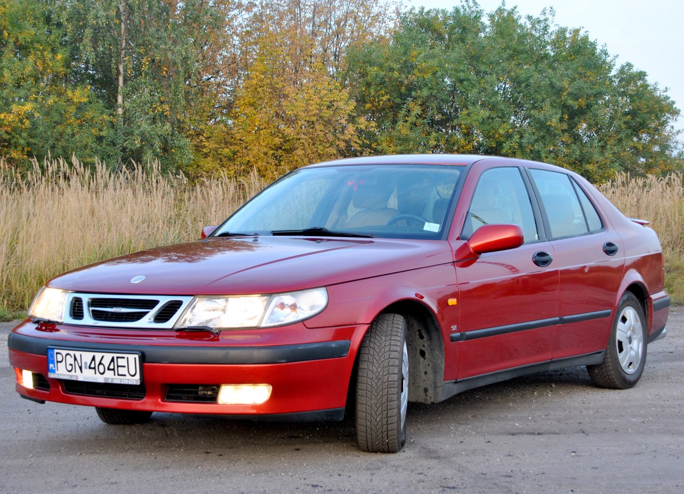 Red sedan with unique grille and fog lights