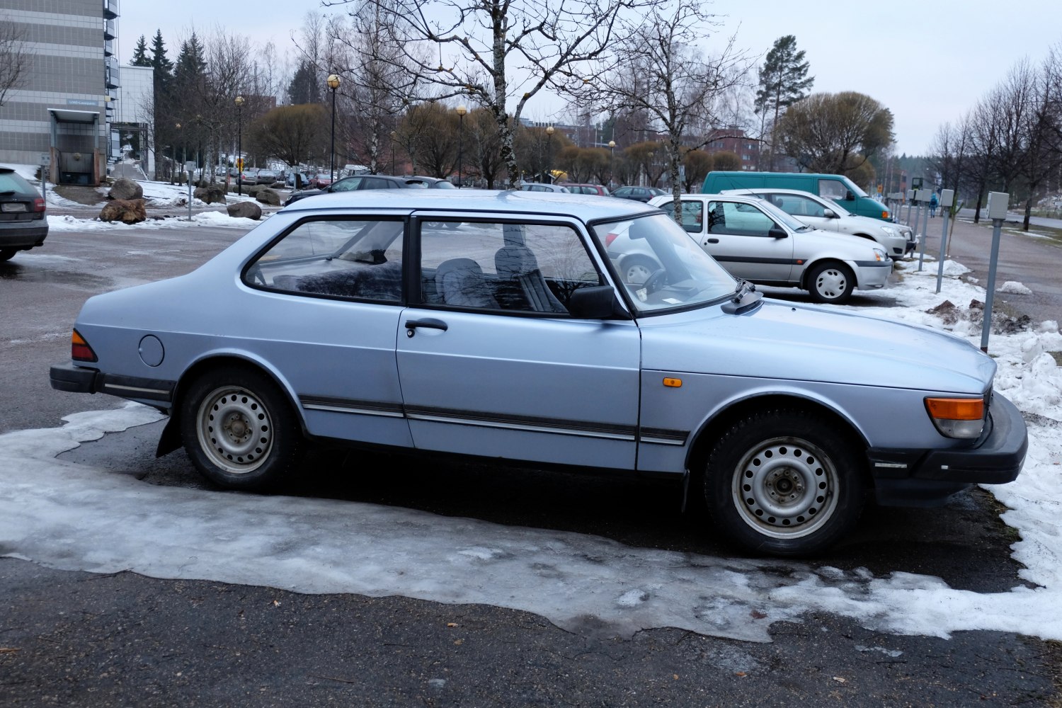 Vintage two-door coupe with steel rims and simple lines