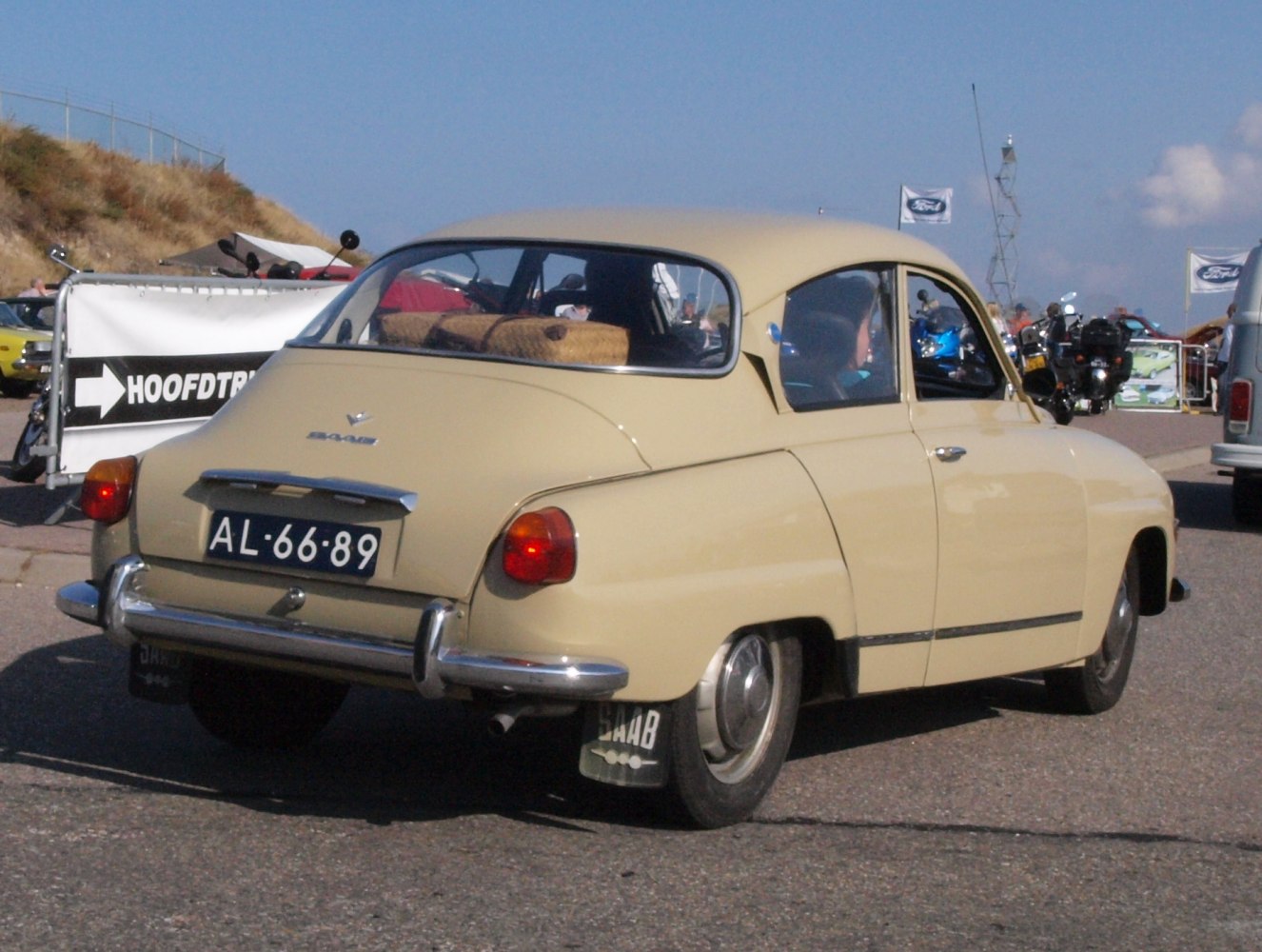 Rounded rear design with classic bumpers and mudflaps.