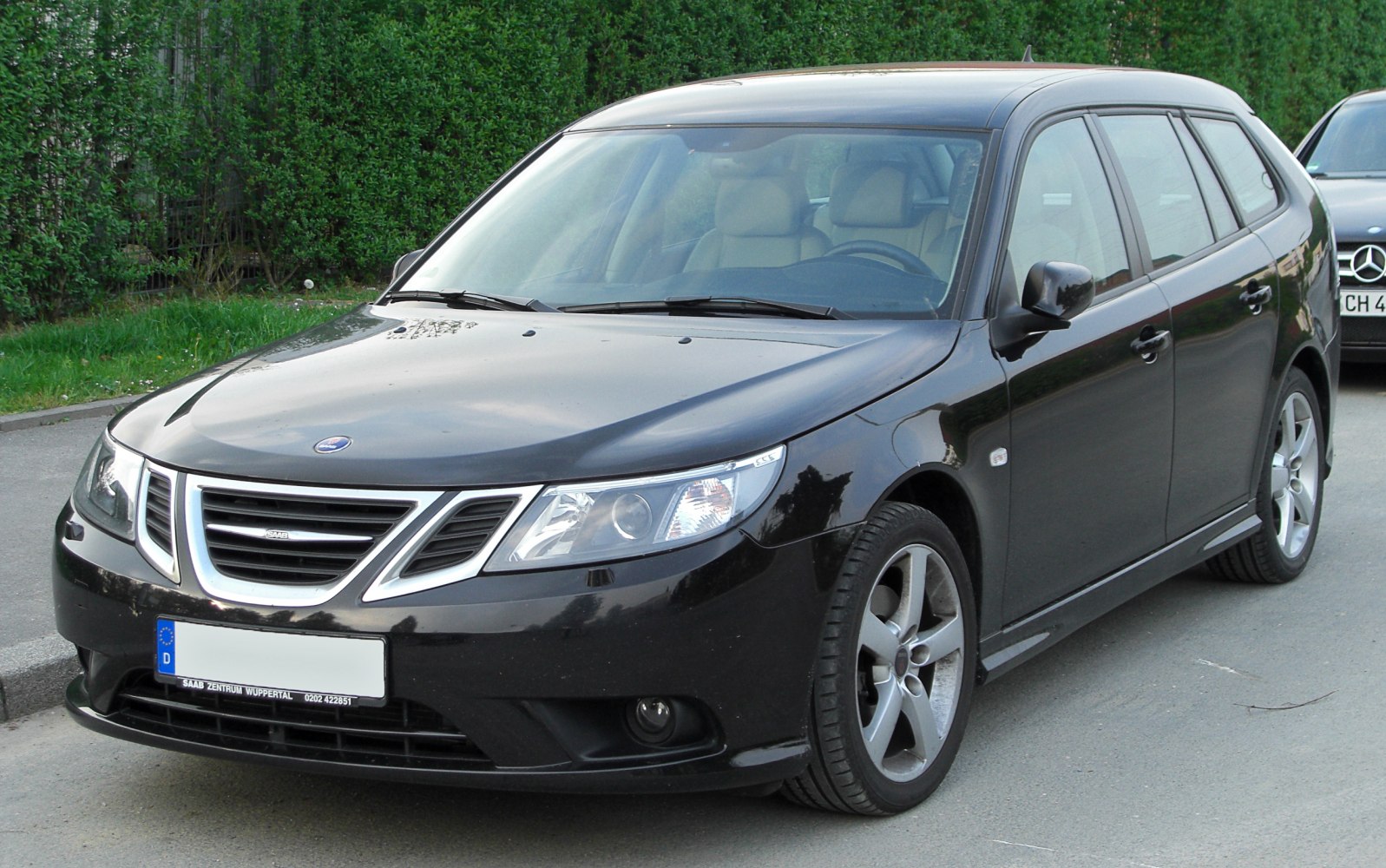 Black wagon with tri-section grille and sleek headlights