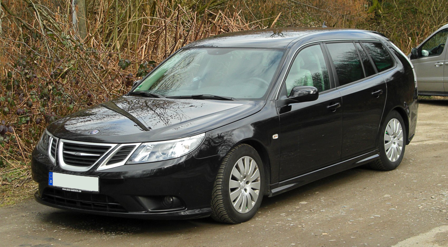Black station wagon with distinctive front grille and roof rails