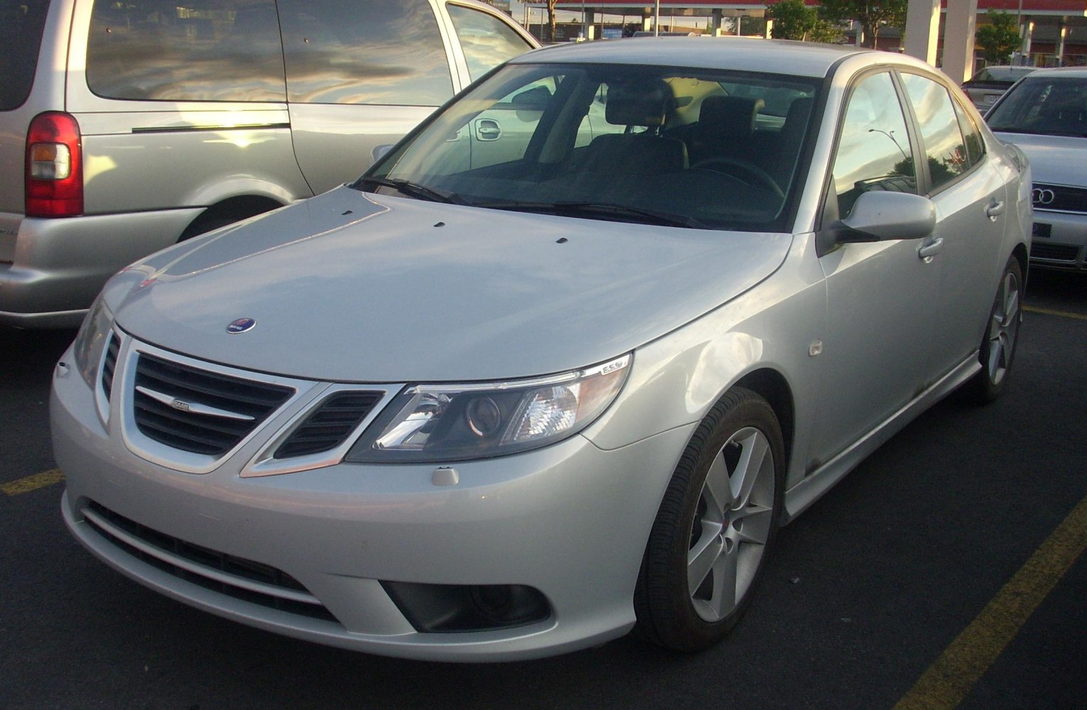 Front three-quarter view of a silver sedan with distinct grille and headlights